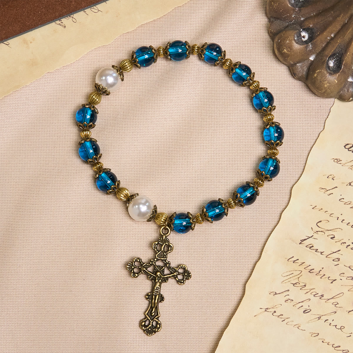Christianartworkshop Spiritual Blue Gloss Bead Bracelets Featuring Sacred Brass Crucifix