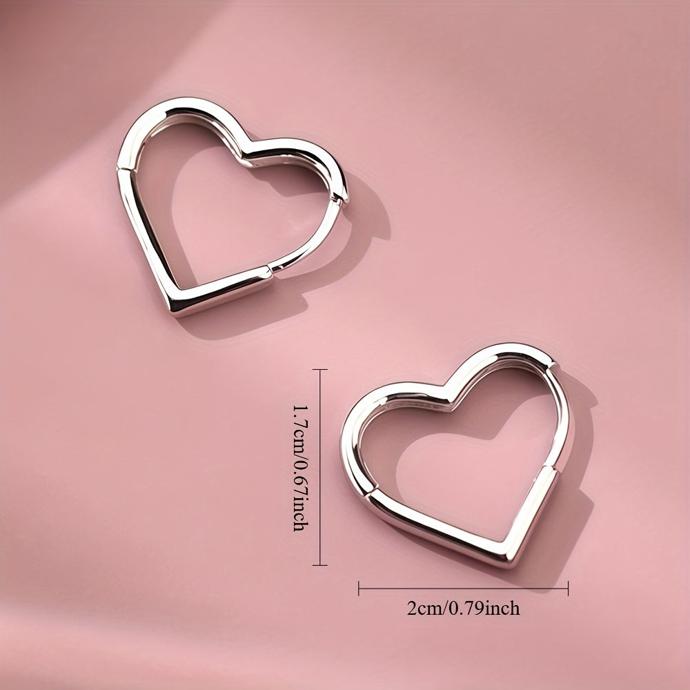 Heart-shaped earrings in stainless steel with gold finish