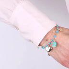 Metal Bracelet with Blue Enamel Bell and Dangling Hearts