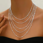 Elegant multi-strand necklace with tassels
