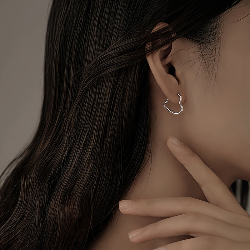 Heart-shaped earrings in stainless steel with gold finish