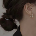 Heart-shaped earrings in stainless steel with gold finish