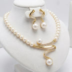 Set of a necklace and earrings with natural pearls