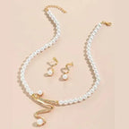 Set of a Necklace and Earrings with Natural Pearls