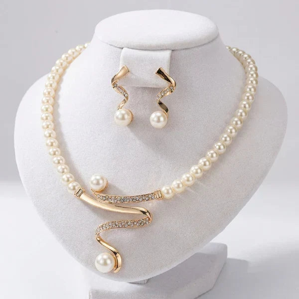 Set of a Necklace and Earrings with Natural Pearls