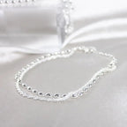 Elegant set of silver bracelets with zircon stones