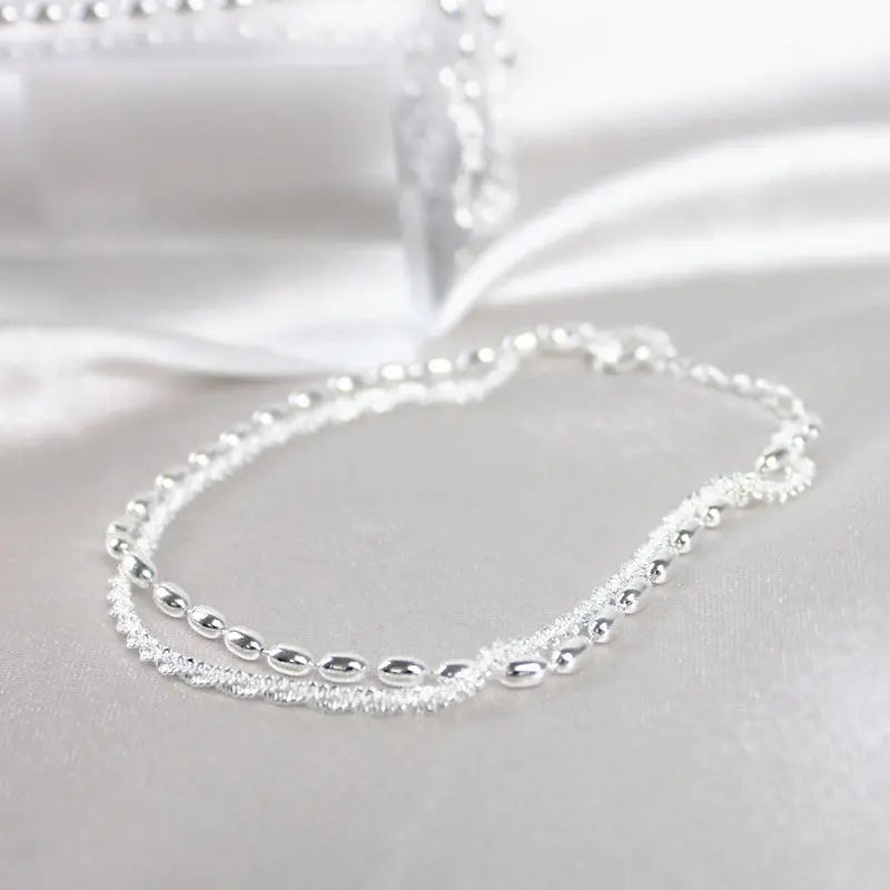 Elegant set of silver bracelets with zircon stones