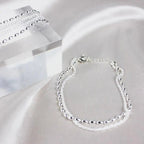 Elegant set of silver bracelets with zircon stones