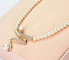 Set of a necklace and earrings with natural pearls