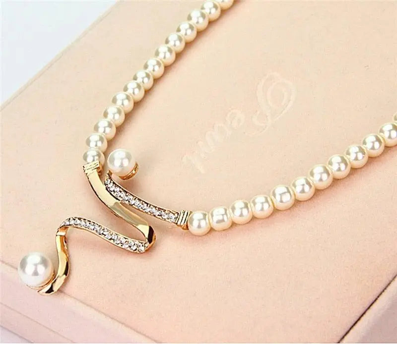 Set of a Necklace and Earrings with Natural Pearls