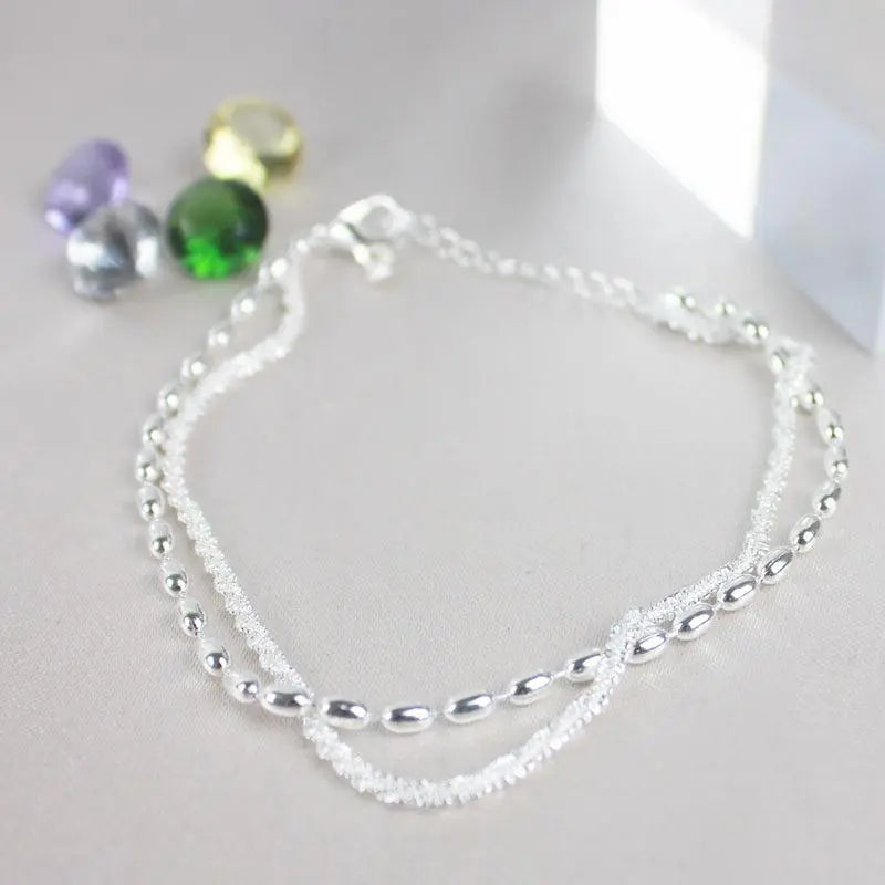 Elegant set of silver bracelets with zircon stones