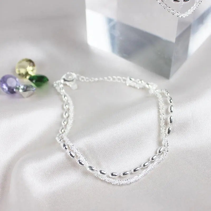 Elegant set of silver bracelets with zircon stones
