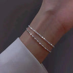 Elegant set of silver bracelets with zircon stones