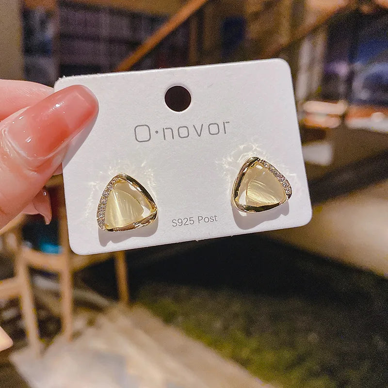 Elegant triangular earrings with opal and crystals
