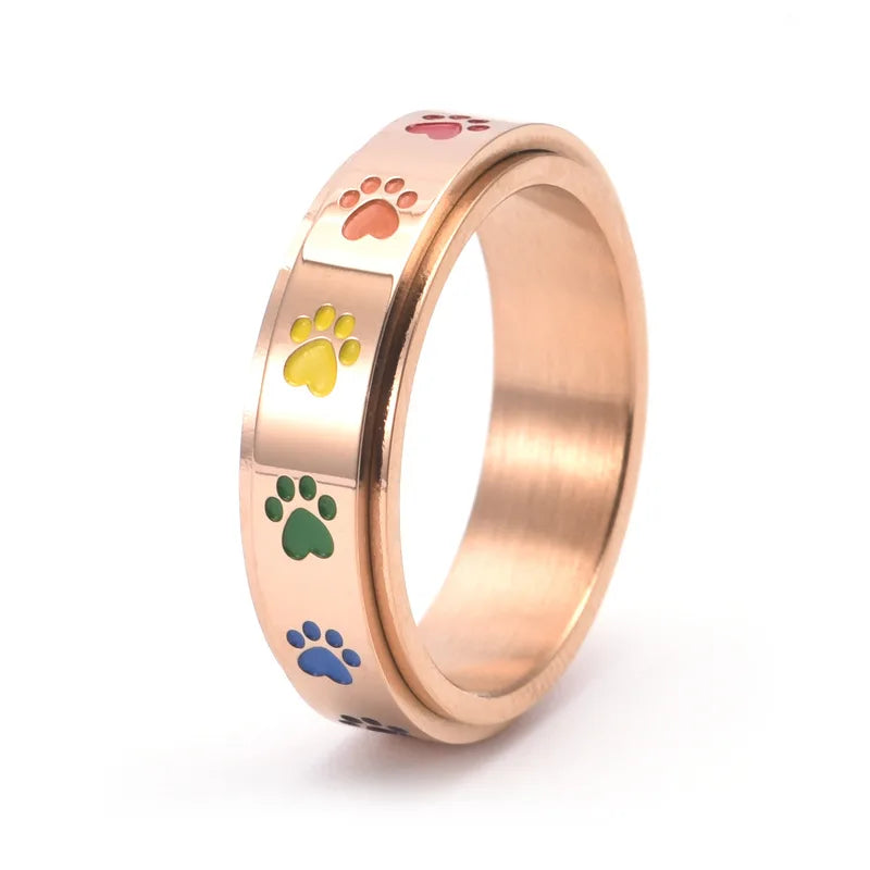 Rotating Stress-Reducing Paw Ring in Stainless Steel with Rainbow Paws