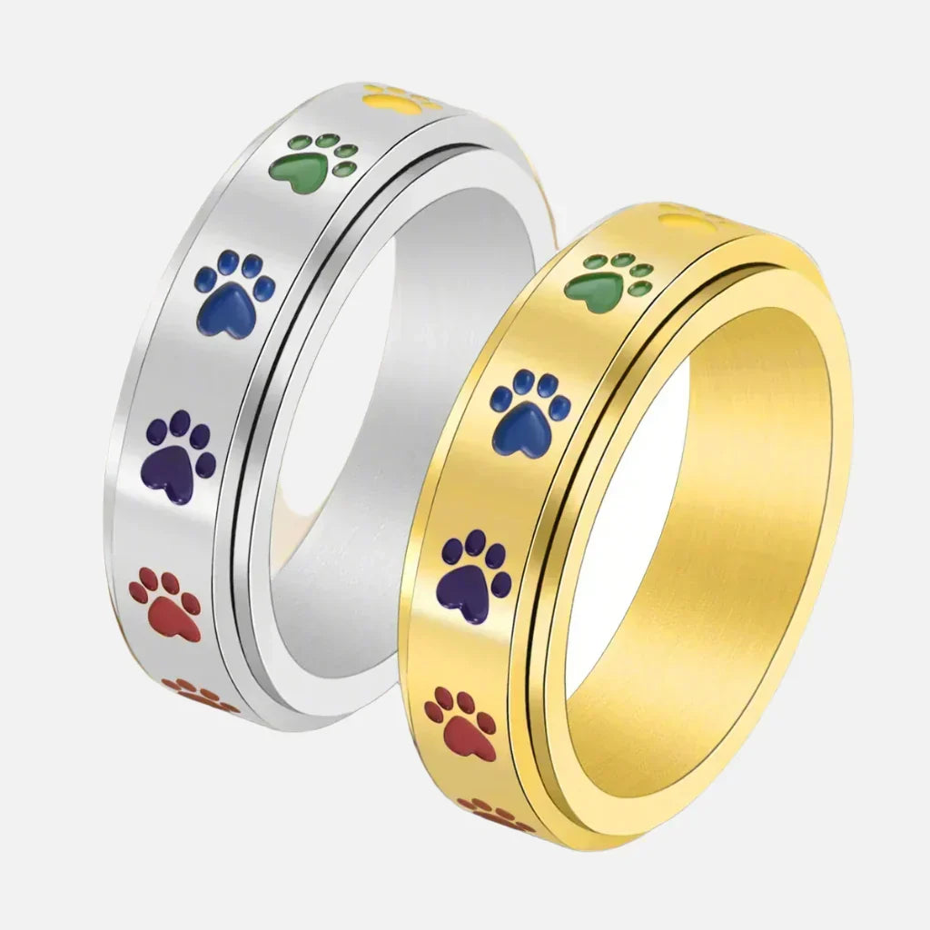 Rotating Stress-Reducing Paw Ring in Stainless Steel with Rainbow Paws