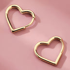 Heart-shaped earrings in stainless steel with gold finish
