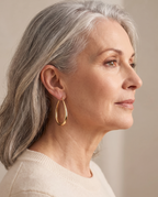 Joséphine Vintage Gold Drop Earrings on mature model