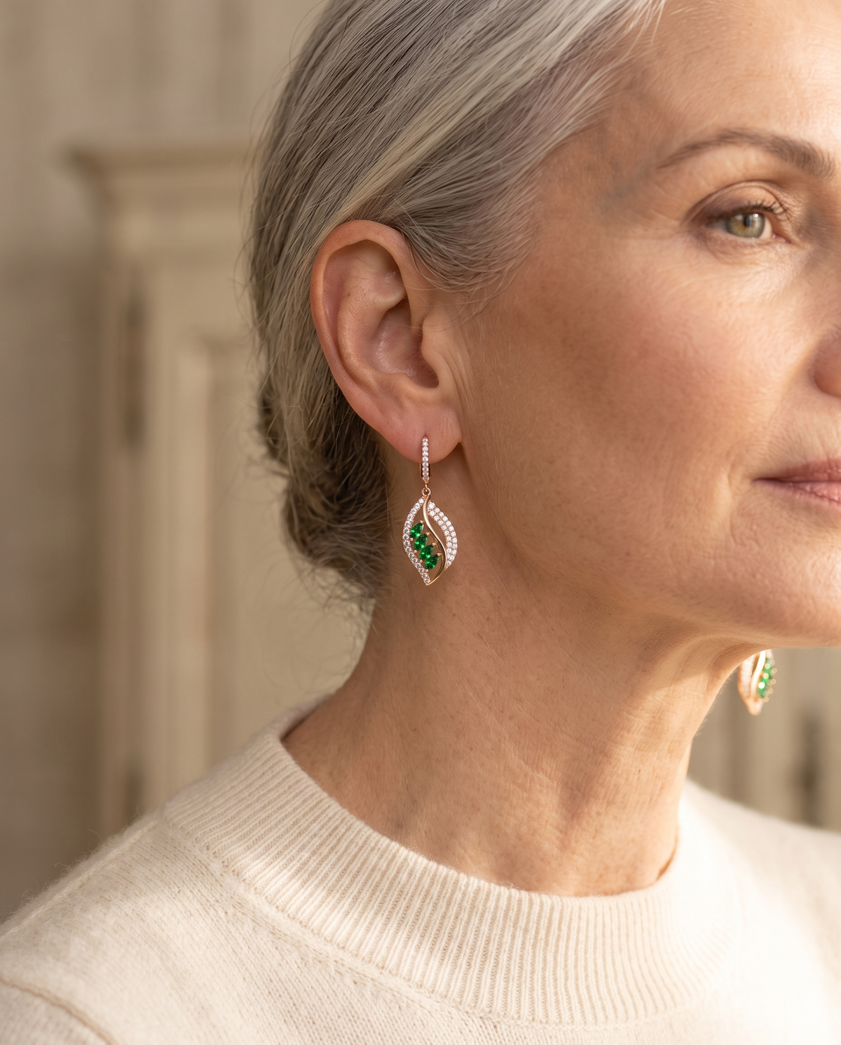 Isola emerald drop earrings worn