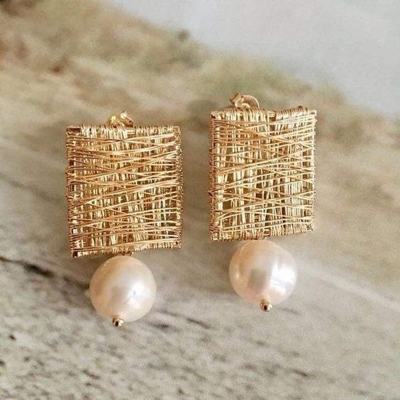 Vintage earrings made of golden threads with pearls